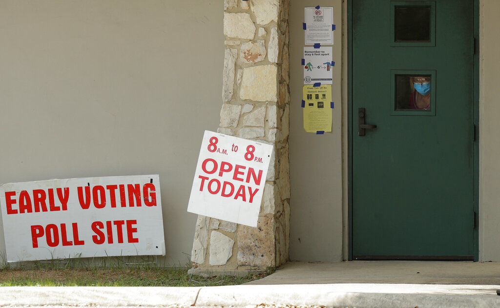 APTOPIX Virus Outbreak Texas Early Voting